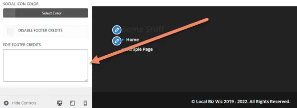 Website footer inside the theme customizer with an arrow pointing to a blank edit footer credits field
